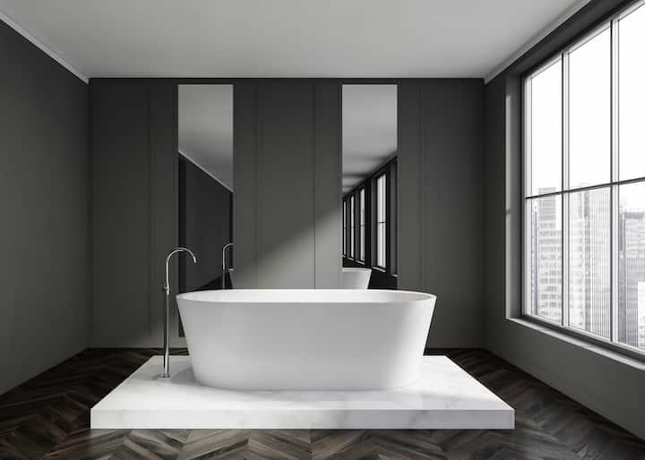 Minimal bathtub installation with grey walls in Boca Raton, FL.